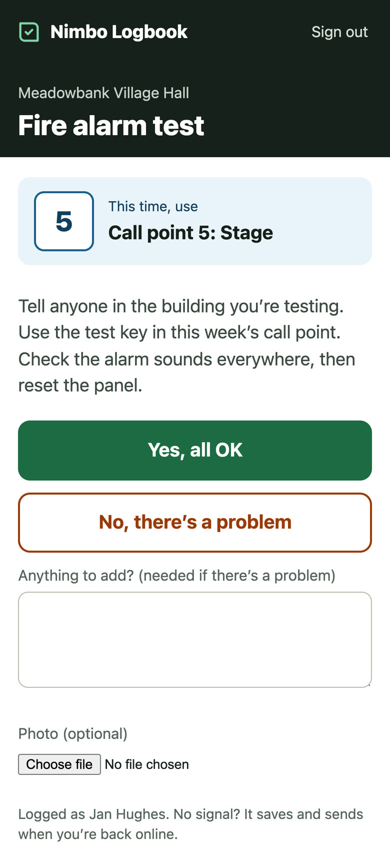 A staff member’s phone showing the fire alarm test with call point 4